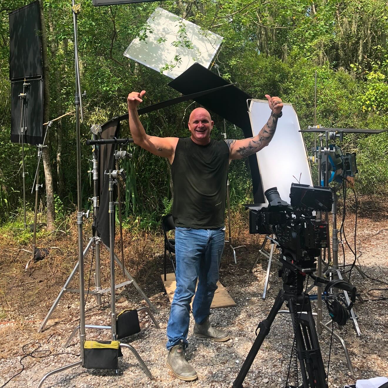 Ronnie Adams from swamp people with camera equipment in a forest setting